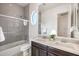 Modern bathroom with double sinks and a tub/shower combo at 6565 E Thomas Rd # 1005, Scottsdale, AZ 85251