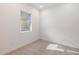 Bright bedroom with carpeted floor and window with blinds at 6565 E Thomas Rd # 1005, Scottsdale, AZ 85251