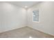 Spacious bedroom with carpeted floor and window with blinds at 6565 E Thomas Rd # 1005, Scottsdale, AZ 85251
