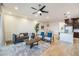 Spacious living room with a gray sofa and two armchairs, coffee table and ceiling fan at 6565 E Thomas Rd # 1005, Scottsdale, AZ 85251
