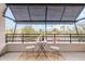 Private patio with table and chairs, offering scenic views at 6565 E Thomas Rd # 1005, Scottsdale, AZ 85251