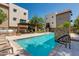 Community pool area with pool, bbq, and lounge chairs at 6990 E 6Th St # 1005, Scottsdale, AZ 85251
