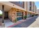 Modern townhome exterior boasts a private garage and unique brickwork at 6990 E 6Th St # 1005, Scottsdale, AZ 85251