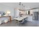 Contemporary kitchen with stainless steel appliances and sleek dining area at 6990 E 6Th St # 1005, Scottsdale, AZ 85251