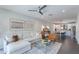 Inviting living room featuring a modern ceiling fan and an open layout to the kitchen at 6990 E 6Th St # 1005, Scottsdale, AZ 85251
