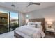 Comfortable main bedroom with a large window and modern ceiling fan at 6990 E 6Th St # 1005, Scottsdale, AZ 85251