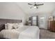 Main bedroom with king-size bed, ceiling fan and backyard access at 707 W Alamo Dr, Chandler, AZ 85225