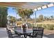 Covered patio with seating area and golf course view at 7956 E Via Costa --, Scottsdale, AZ 85258