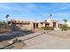 Tan stucco house with a red tile roof, two car garage, and nicely landscaped front yard at 8412 N Via Mia --, Scottsdale, AZ 85258