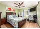 Bright bedroom with ceiling fan and built-in shelving at 9333 E University Dr # 55, Mesa, AZ 85207