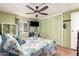 Bedroom with ceiling fan and spacious closet at 9333 E University Dr # 55, Mesa, AZ 85207