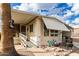 Inviting single-wide manufactured home with covered porch and landscaped yard at 9333 E University Dr # 55, Mesa, AZ 85207