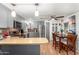 Modern kitchen with gray cabinets, stainless steel appliances and breakfast bar at 9333 E University Dr # 55, Mesa, AZ 85207