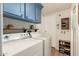 Laundry room offers ample storage and a modern aesthetic at 9333 E University Dr # 55, Mesa, AZ 85207