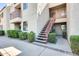 Exterior view showing stairs and landscaping leading to condo entrance at 9355 N 91St St # 212, Scottsdale, AZ 85258