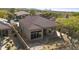 Backyard with covered patio, desert landscaping, and mountain views at 9514 E Cavalry Dr, Scottsdale, AZ 85262