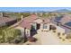 Single-story home with tile roof and solar panels; mountain views at 9514 E Cavalry Dr, Scottsdale, AZ 85262