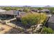 Backyard with covered patio, desert landscaping, and mountain views at 9514 E Cavalry Dr, Scottsdale, AZ 85262