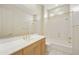Bathroom with marble vanity and bathtub at 9514 E Cavalry Dr, Scottsdale, AZ 85262