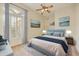 Comfortable guest bedroom featuring a queen-size bed and plantation shutters at 9514 E Cavalry Dr, Scottsdale, AZ 85262