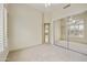 Bedroom with mirrored closet doors and view to game room at 9514 E Cavalry Dr, Scottsdale, AZ 85262