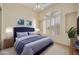 Spacious bedroom with large window, plush bedding, and ample natural light at 9514 E Cavalry Dr, Scottsdale, AZ 85262