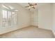 Bedroom with plantation shutters and built-in shelves at 9514 E Cavalry Dr, Scottsdale, AZ 85262