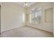 Bedroom with plush carpeting and large window at 9514 E Cavalry Dr, Scottsdale, AZ 85262