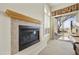 Cozy fireplace with tile surround and patio access at 9514 E Cavalry Dr, Scottsdale, AZ 85262