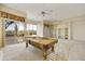 Game room with pool table and access to backyard patio at 9514 E Cavalry Dr, Scottsdale, AZ 85262