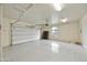 Spacious two-car garage with ample storage space and painted floor at 9514 E Cavalry Dr, Scottsdale, AZ 85262