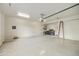Bright and clean garage featuring overhead storage and extra space at 9514 E Cavalry Dr, Scottsdale, AZ 85262
