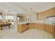 Spacious kitchen with ample cabinetry and views of the game room at 9514 E Cavalry Dr, Scottsdale, AZ 85262