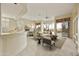 Bright living room with open floor plan, fireplace, and access to backyard patio at 9514 E Cavalry Dr, Scottsdale, AZ 85262