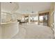 Open living space with a pool table and views of the patio at 9514 E Cavalry Dr, Scottsdale, AZ 85262