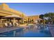 Inviting community pool with lounge chairs and umbrellas at 9514 E Cavalry Dr, Scottsdale, AZ 85262