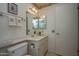 Clean bathroom with single sink vanity, toilet and shower/tub combo at 9614 N 110Th Ave, Sun City, AZ 85351