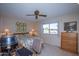 Bedroom with queen bed, built-in desk and backyard view at 9614 N 110Th Ave, Sun City, AZ 85351