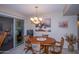 Dining area with a round wooden table and four chairs at 9614 N 110Th Ave, Sun City, AZ 85351