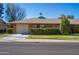 House with a beige exterior, attached garage, and neat landscaping at 9614 N 110Th Ave, Sun City, AZ 85351