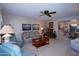 Living area featuring a corner fireplace and ample seating at 9614 N 110Th Ave, Sun City, AZ 85351