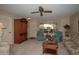 Living room with carpeted floor, comfortable seating, and a ceiling fan at 9614 N 110Th Ave, Sun City, AZ 85351