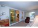 Relaxing sunroom with access to patio and views of the outdoors at 9614 N 110Th Ave, Sun City, AZ 85351