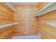 Walk-in closet with wood paneling and ample hanging space at 10529 W Pineaire Dr, Sun City, AZ 85351