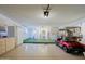 Spacious garage with golf cart and laundry area at 10529 W Pineaire Dr, Sun City, AZ 85351