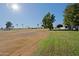 View of a golf course with trees and homes in the background at 10529 W Pineaire Dr, Sun City, AZ 85351