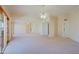 Bright living room featuring a neutral color palette and multiple ceiling fans at 10529 W Pineaire Dr, Sun City, AZ 85351