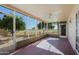 Bright screened porch with golf course view at 10529 W Pineaire Dr, Sun City, AZ 85351