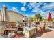 Relaxing patio area with seating and umbrellas, perfect for outdoor entertaining at 11596 W Sierra Dawn Blvd # 134, Surprise, AZ 85378