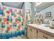 Clean bathroom with shower/tub combo, vanity, and beach-themed decor at 11596 W Sierra Dawn Blvd # 134, Surprise, AZ 85378